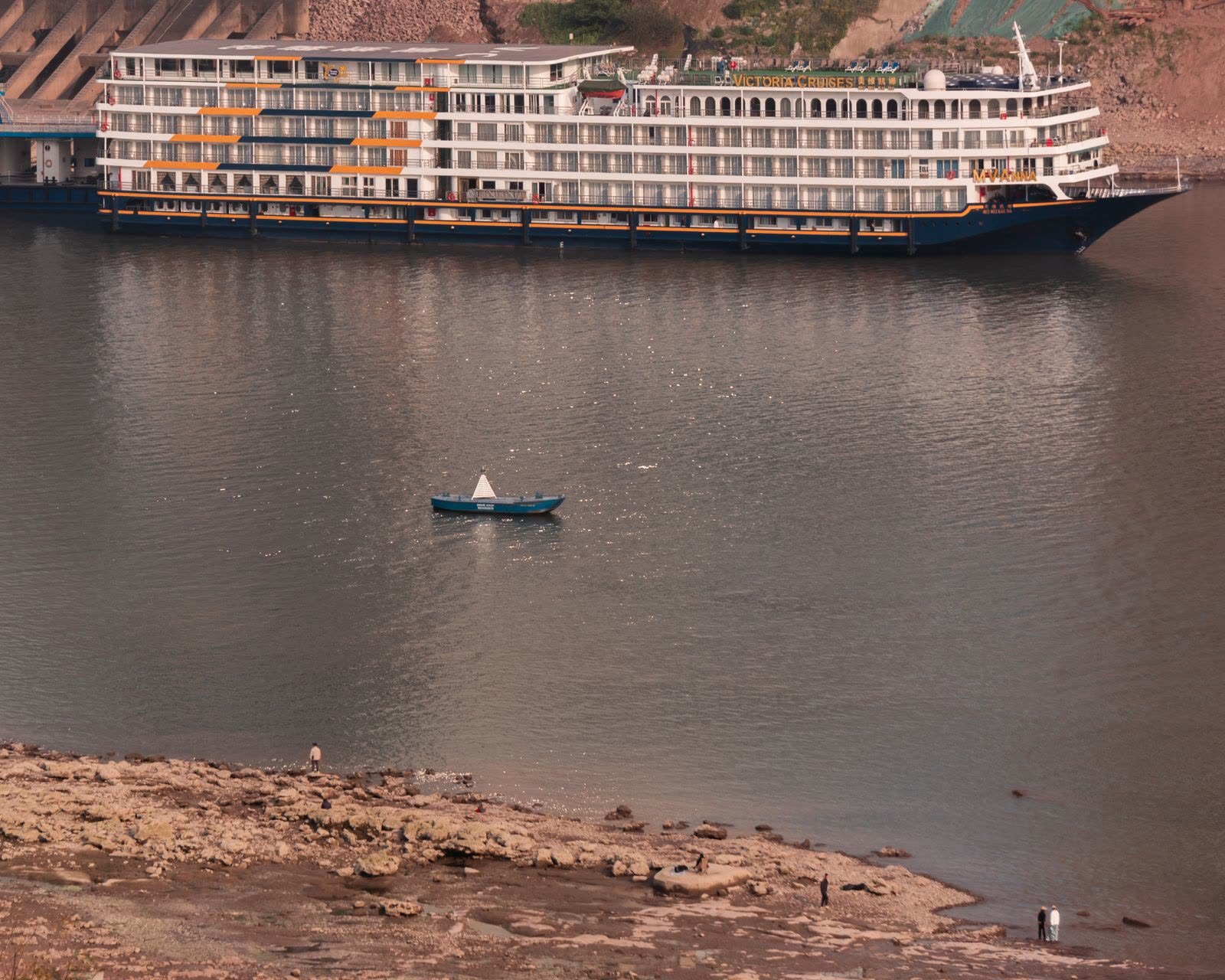 Luxury Nile cruise ship sailing on a calm river at golden hour