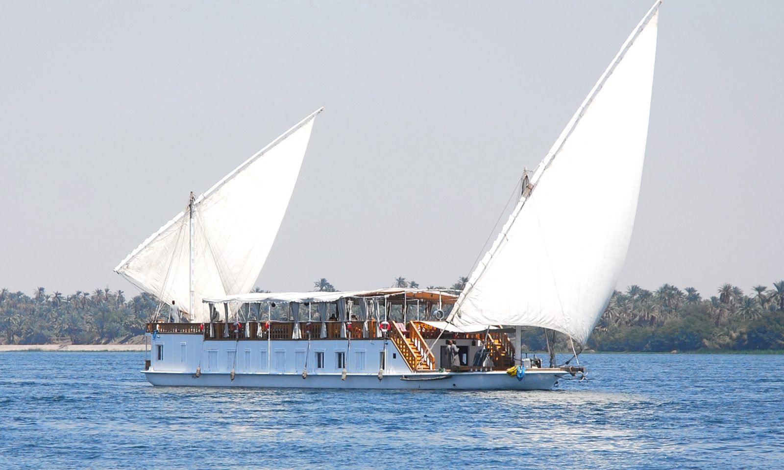 Swan luxury dahabiya sailing peacefully on the Nile