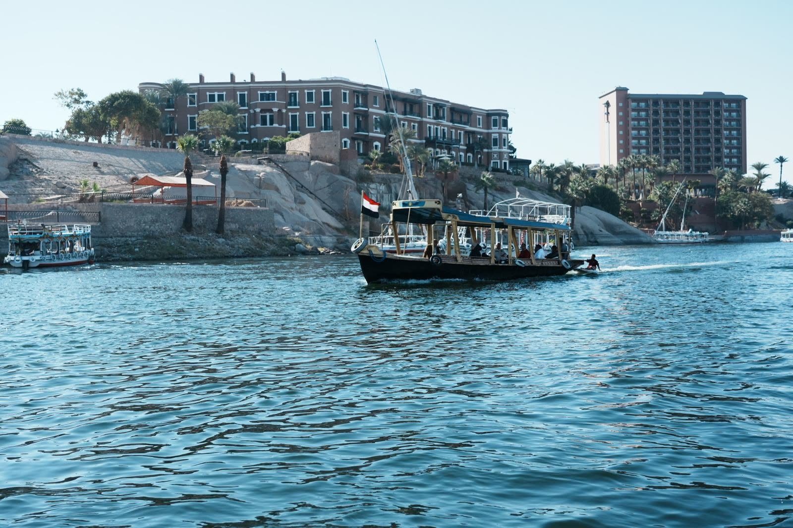 Deluxe Nile cruise sailing near Aswan under a clear sky